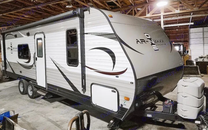 This grey and white travel trailer, a great option for your next RV rental, is ready for adventure with its awning and dual axles.. Starcraft AR-One Maxx 2017