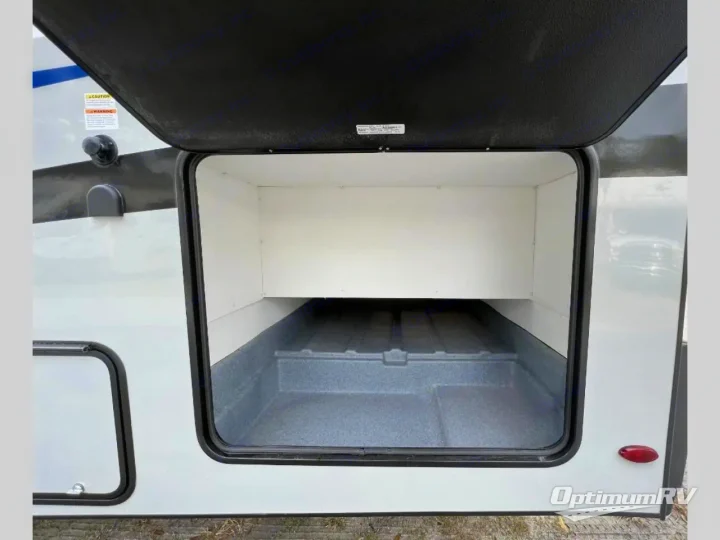 This RV rental offers ample exterior storage space with an open compartment, featuring a shelf & durable floor for your gear.. Forest River Solera 2024