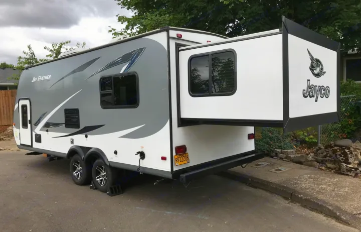 Jayco Jay Feather travel trailer RV rental, featuring an extended slide-out. Ideal for your next trip.. Jayco X213 2016