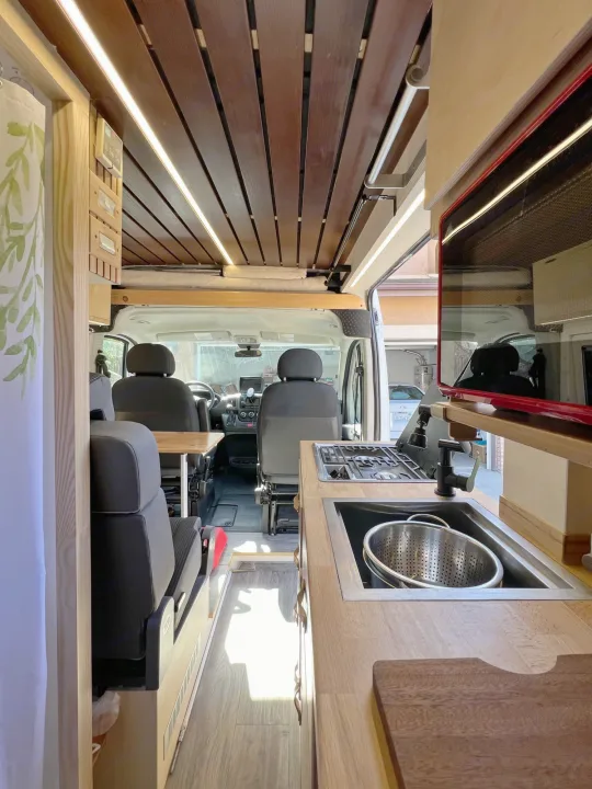 This RV rental showcases a compact, modern interior with a well-equipped kitchen, comfortable seating, and bright LED lighting.. Ram promaster 2500 2017