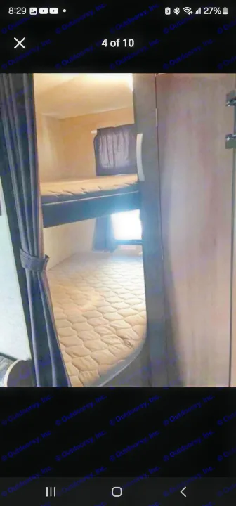 Compact RV rental interior featuring convenient bunk beds with mattresses for extra sleeping space, ideal for travel.. StarCraft autumn ridge 2014