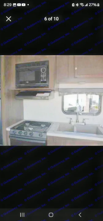RV rental kitchen: This compact space has a microwave, stovetop, double sink, and window, ready for meals on the go.. StarCraft autumn ridge 2014