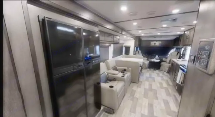 Spacious RV rental motorhome interior features a modern living area, kitchen, and cockpit. Ideal for travel.. FR3 FR3 Motorhome 2023