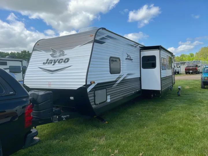 Spacious Jayco Jay Flight travel trailer RV rental with extended slide-out, set on green grass for outdoor adventures.. Jayco Jay Flight 2022