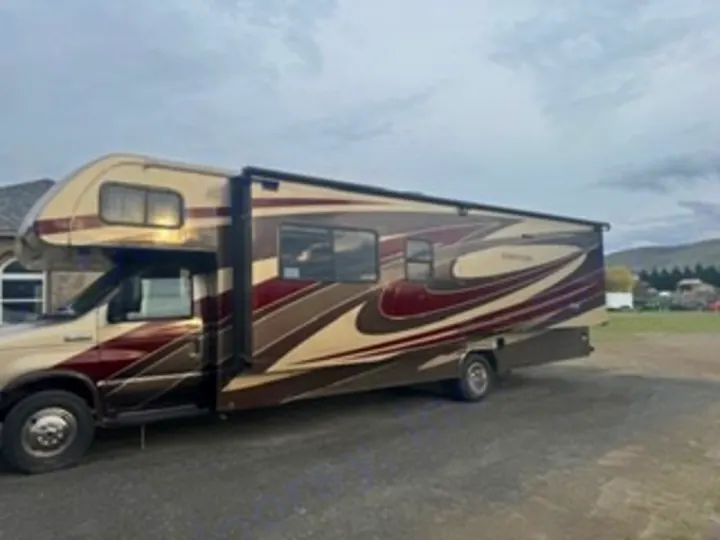 RV rental: A tan and burgundy Class C motorhome with an extended awning, perfect for road trips and camping adventures.. Forest River 3051S Ford 2017