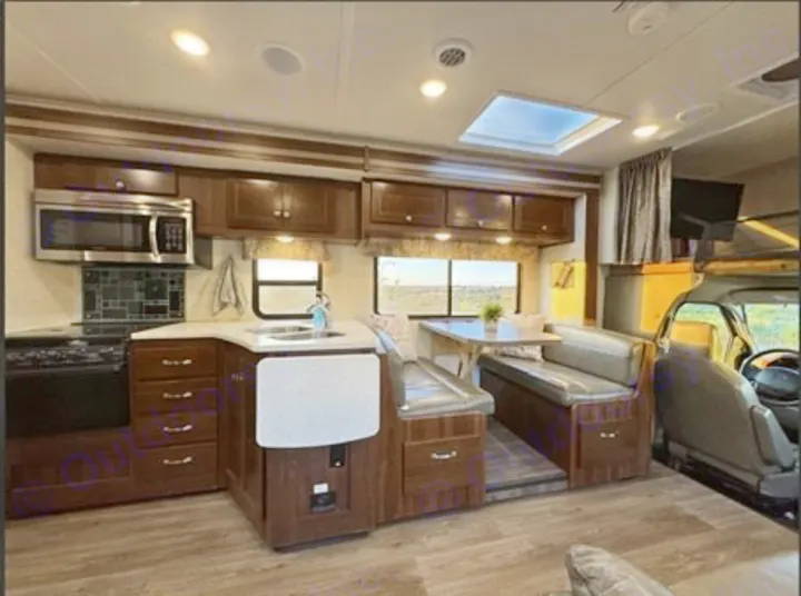 Spacious RV rental: well-equipped kitchen, dinette, and forward cockpit area, ready for adventure.. Forest River 3051S Ford 2017