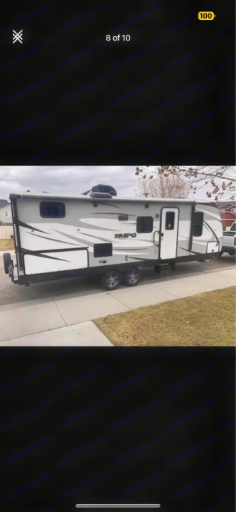 RV rental: Modern grey MPG travel trailer with distinctive graphics, parked. Ready for your next adventure.. Cruiser RV MPG Ultra Lite 2019