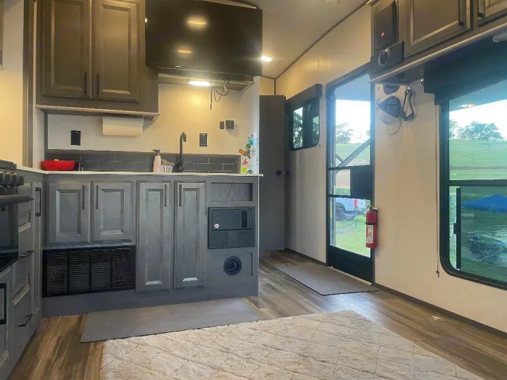 Your RV rental escape! Modern kitchen, comfortable living space, and scenic outdoor views from inside.. Heartland 265 2021
