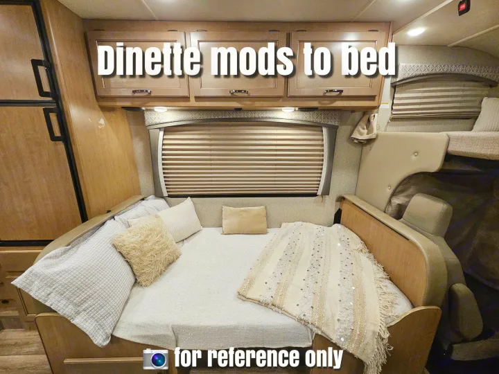 This RV rental interior features a dinette cleverly converted into a comfortable bed, complete with pillows and blankets.. Thor Motor Coach Four Winds 2021