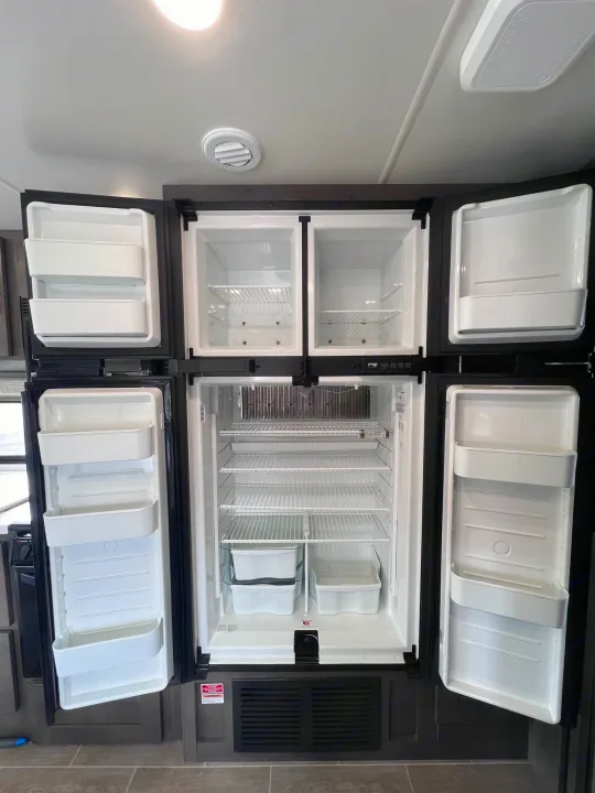 This spacious, clean RV rental refrigerator is ready for your adventure. It features four doors: two top freezers and two bottom fridges.. Forest River Georgetown 2022