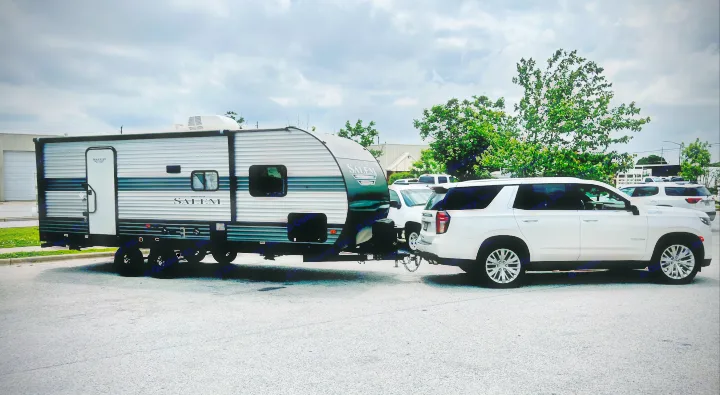 White SUV towing a grey Salem travel trailer RV. Great option for an RV rental adventure!. Forest River Salem 2020