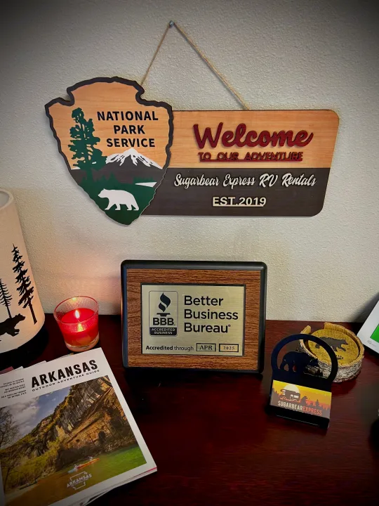 "Sugarbear Express RV Rentals" welcome sign (National Park-style), BBB accredited through APR 2025, and an Arkansas guide.. Forest River Salem 2020