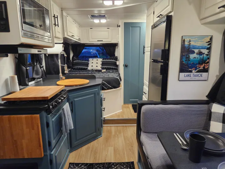 Modern RV rental interior with kitchen, dining, and bedroom spaces. A cozy, fully equipped travel experience.. Four Winds Majestic 2008