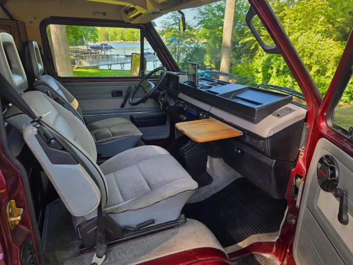 RV rental: Step inside this vintage camper van, offering a peaceful lake view for your next adventure.. Volkswagen Westfalia 1990