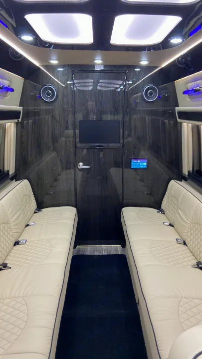 Experience luxury travel in this custom RV rental. Cream quilted seats, wood paneling, and entertainment screen make for premium comfort.. Ultimate Toys Ultimate Coach 2024