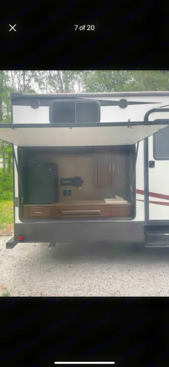 This RV rental offers a complete outdoor entertainment & kitchen setup with a fridge, TV mount, and grill.. Heartland RVs Sundance XLT 2016