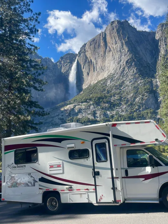 Stunning RV rental view of Yosemite Falls and towering cliffs. Perfect for a nature-filled travel adventure.. Coachmam Freelander 21QB 2012