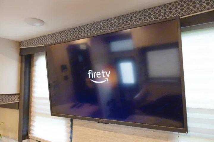 An Insignia Fire TV screen displaying its logo, ready for onboard entertainment in this RV rental.. Thor A.C.E. 2023