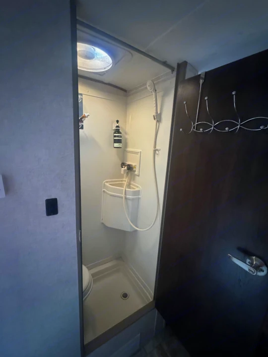 RV rental compact wet bath: integrated toilet/shower area, fold-down sink, soap dispenser, overhead vent.. R-Pod R-Pod Trailer 2018