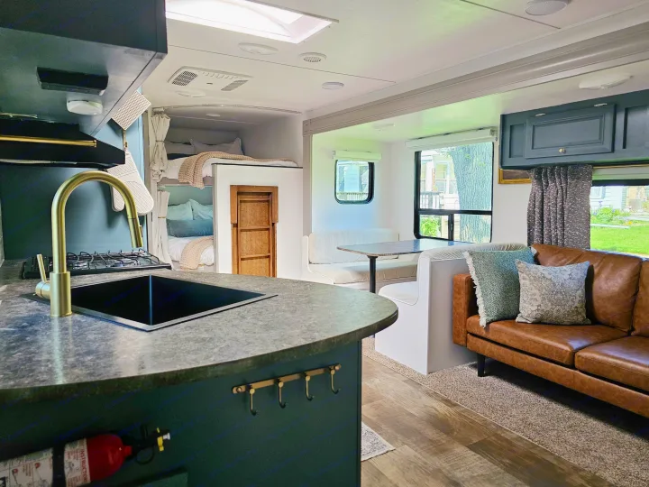 Explore this modern RV rental interior: a sleek kitchen, cozy living room, dining booth, and convenient bunk beds.. Crossroads RV Z-1 2017