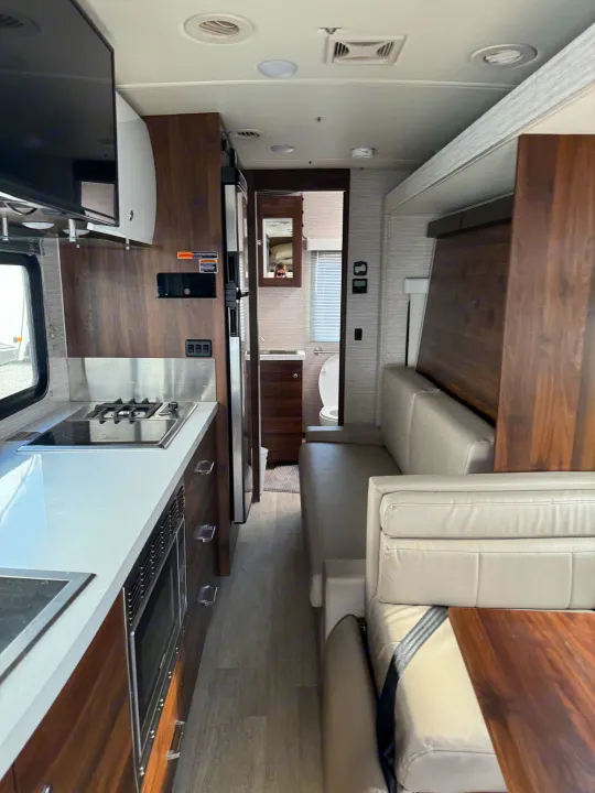 This RV rental features a modern interior with a well-equipped kitchen, comfortable living area, and accessible bathroom.. Winnebago View 2022