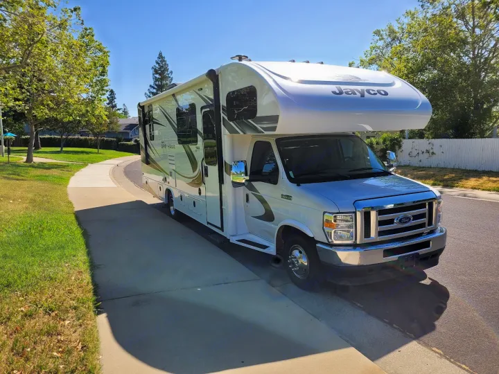 Explore with this Jayco Greyhawk motorhome RV rental, parked on a sunny day for your next adventure.. Jayco Greyhawk 2021