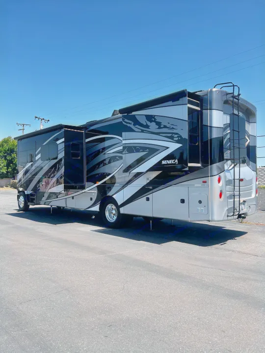 Jayco Seneca RV rental: A modern black and silver motorhome with extended slide-outs, ready for your next adventure.. Jayco Seneca 2021