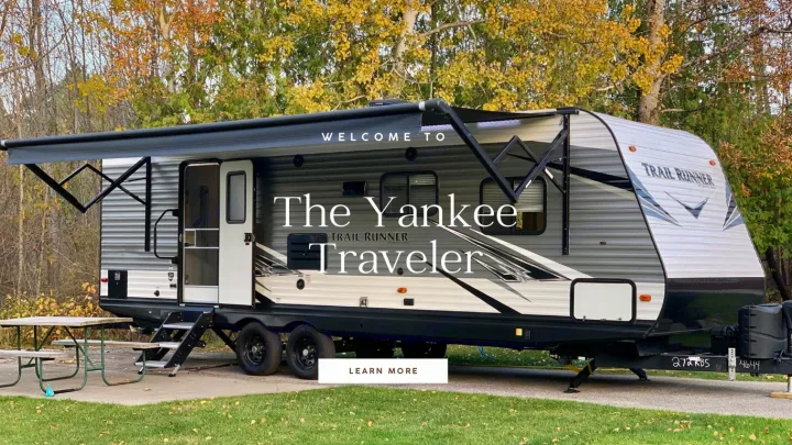 Parked at a fall campsite, "The Yankee Traveler" travel trailer is ready for your next RV rental adventure.. Heartland RVs Trail Runner 2021