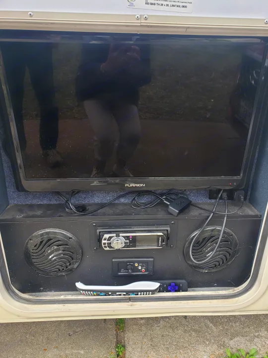 RV rental outdoor entertainment bay with a Furrion TV, stereo, and Roku. Perfect for camping movies & music.. Forest River Coachmen Leprechaun 2015