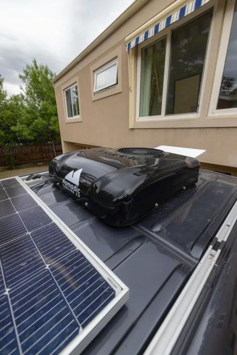 Top of an RV rental: Nomadic Cooling Co AC & solar panels for cool, sustainable adventures.. Mercedes Sprinter 2500 2024