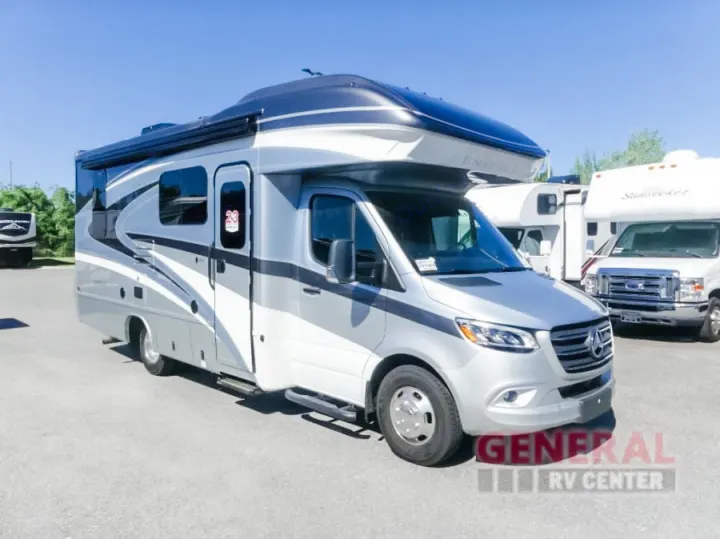 Silver Entegra Class C RV, likely a Sprinter chassis, available for rv rental on a sunny dealership lot.. Entegra Coach Qwest 24L 2024