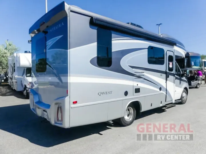 A striking grey and white Entegra Qwest motorhome, ideal for rv rental, showcased outdoors on a sunny day with other RVs.. Entegra Coach Qwest 24L 2024