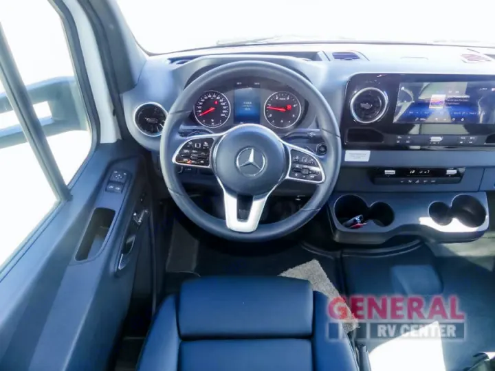 Spacious RV rental driver's cockpit: Mercedes-Benz steering wheel, digital dashboard, and large infotainment screen.. Entegra Coach Qwest 24L 2024