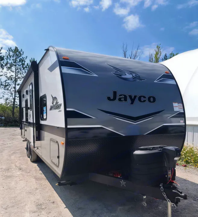 Jayco travel trailer RV rental: This stylish gray & white camper features an aerodynamic front design and a robust hitch.. Jayco Jay Flight SLX 2024