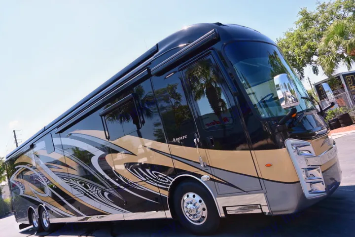 This sleek black and tan luxury motorhome, an Entegra Aspire, offers premium comfort for your next RV rental journey.. Entegra Coach Aspire 2019
