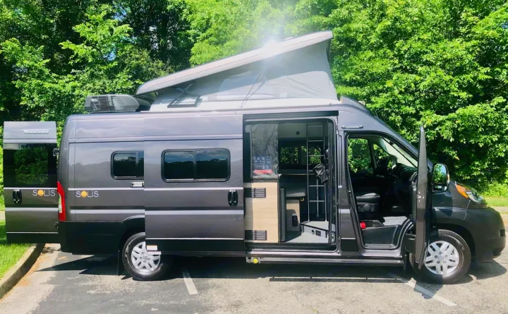 Gray Winnebago Solis pop-top camper van, perfect for RV rental. Doors open to show interior details.. Winnebago Solis 2023