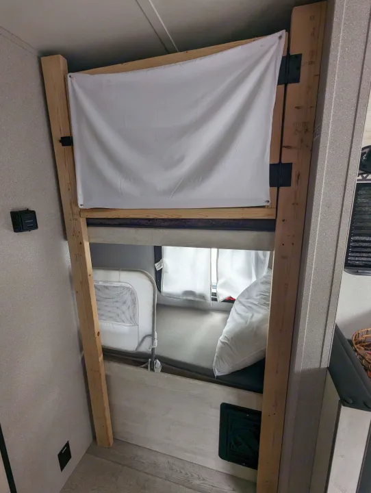 RV rental: Bunk beds with a fabric privacy screen for the top bunk and a child rail for the lower bunk.. Grand River Comfortline 20bh 2022