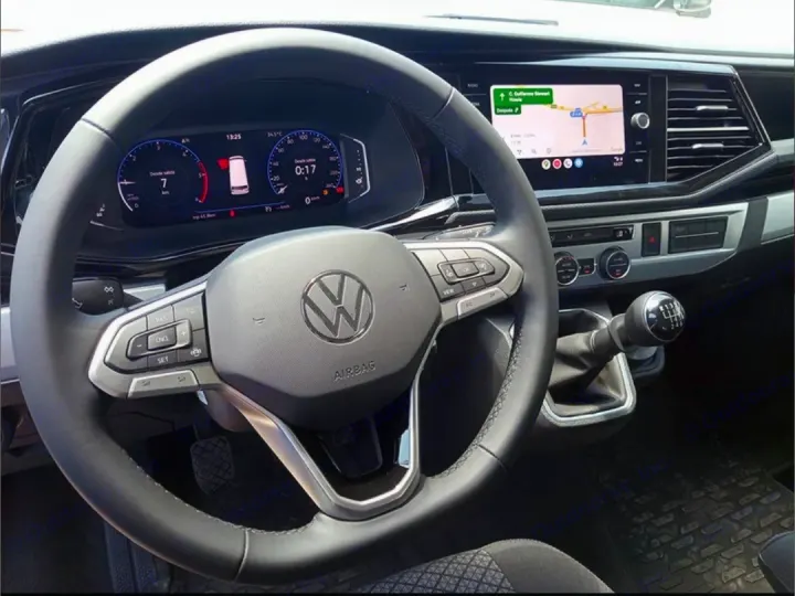 Modern VW rv rental interior: digital dash, navigation screen, and 6-speed manual gearbox. Spacious, well-equipped cabin.. Volkswagen California Beach Camper 2.0 TDI 2023
