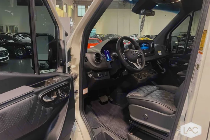 Inside a premium RV rental: Mercedes-Benz Sprinter driver's area featuring quilted leather and high-tech dashboard.. Midwest Automotive Designs Luxe Cruiser 2024
