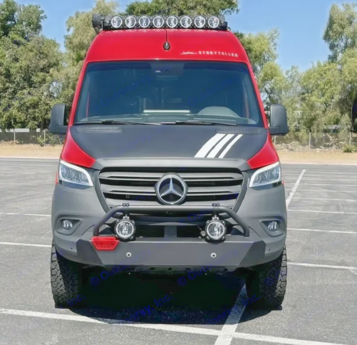 Front of a customized red & black Mercedes-Benz Sprinter van, great for rv rental. Features off-road bumper and roof LED lights.. Storyteller Overland Beast Mode AWD 2024