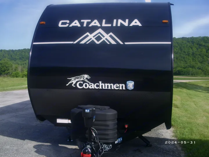 Sleek black Catalina Coachmen travel trailer, ready for RV rental adventures.. COACHMAN CATALINA 261BHS 2024