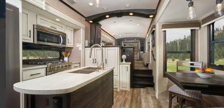 Experience comfort in this modern RV rental! Features a spacious kitchen, island, dining area, & scenic window views.. Jayco North Point 2021
