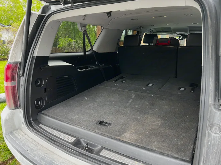 Spacious SUV cargo area, 3rd-row seats folded flat. Ideal for gear on an RV rental trip or any vehicle travel.. Chevrolet Suburban 2015