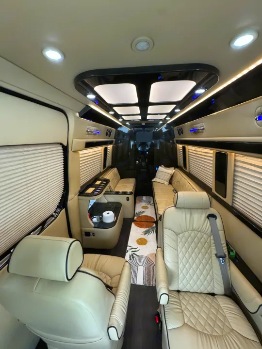 Step into luxury with this custom van interior, featuring plush seating and ambient lighting, ideal for your next rv rental trip.. Midwest Automotive Designs Super Sprinter 2019