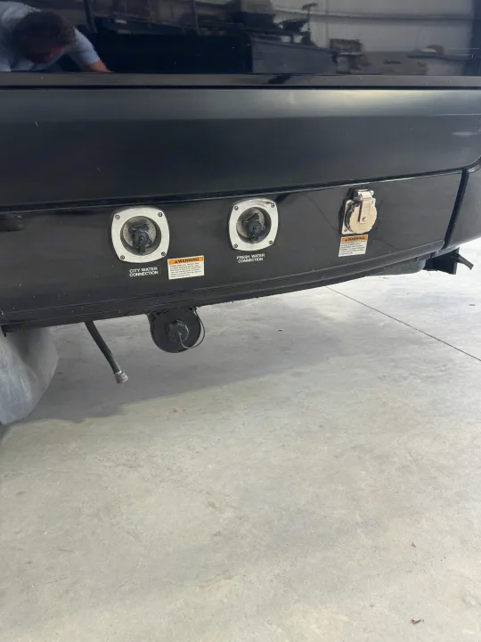 RV rental's rear panel: city water, fresh water, and 30-amp power connections for essential hookups at a campsite.. Midwest Automotive Designs Super Sprinter 2019
