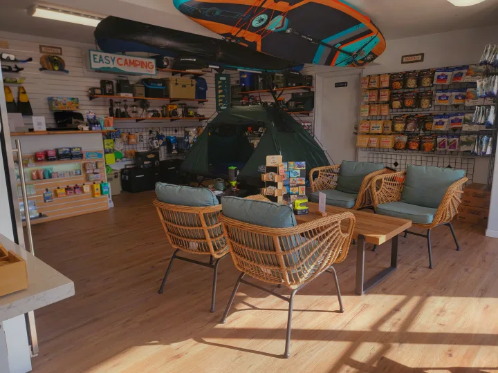 Shop interior: essential camping gear, a tent display, packaged food, and paddleboards, great for an RV rental trip.. Jeep Jeep Wrangler Overland 2017