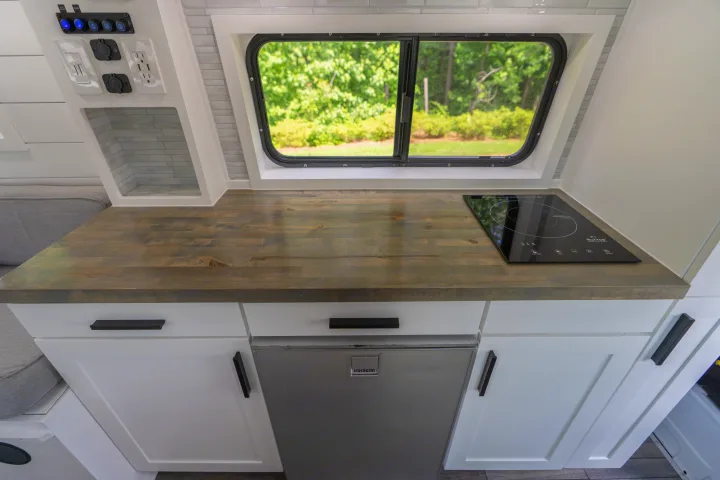 Enjoy prepping meals without feeling crammed into one tiny space, we even provide an extra portable butane stove so you can cook up a feast!. Mercedes-Benz Sprinter 2020