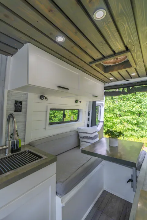 The rear U-shape dinette can be used for meals, working, or lounging. Enjoy a breeze using the vent fan overhead, or opening the rear bunk windows.. Mercedes-Benz Sprinter 2020