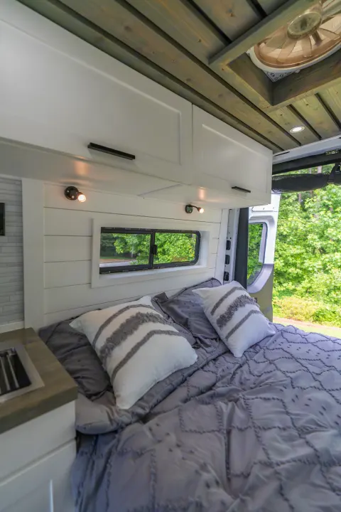 The bedroom also includes overhead storage and reading lights!. Mercedes-Benz Sprinter 2020