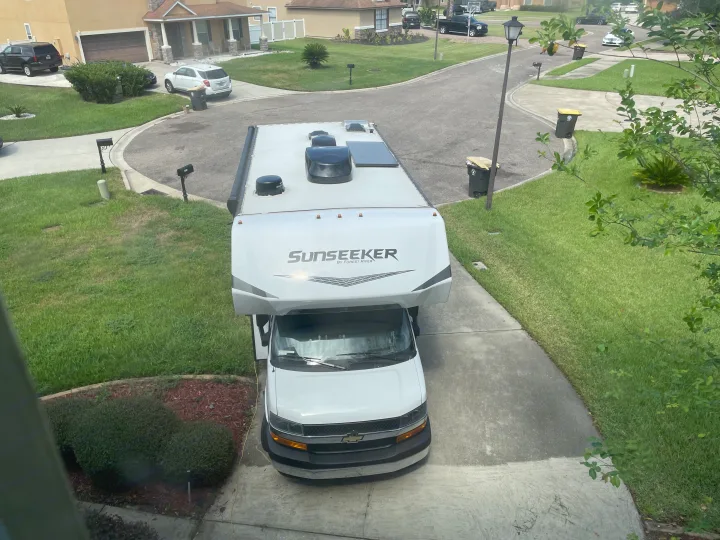 Overhead view of a white Sunseeker RV parked on a driveway. Explore this RV rental for your next trip.. Forest River Sunseeker LE 2023